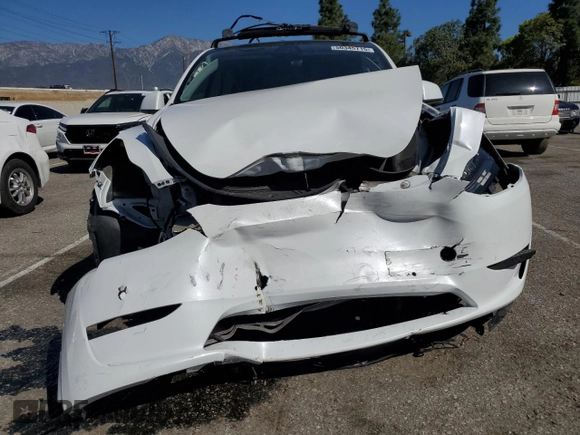2022 Tesla Model Y Long Range with VIN 7SAYGDEE4NF357428, listed as a Copart auction lot 50345715 with 45,168 mi miles and Salvage Title. Bid and sale history available at carsss.com. Image 5.