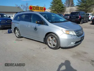 2012 Honda Odyssey Touring with VIN 5FNRL5H95CB063003, listed as a IAAI auction lot 41871975 with 179,332 mi miles and . Bid and sale history available at DreamBid. Image 1.
