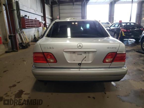 1999 Mercedes-Benz E-Class with VIN WDBJF82H4XX021888, listed as a Copart auction lot 83069274 with 173,198 mi miles and Salvage Title. Bid and sale history available at carsss.com. Image 6.
