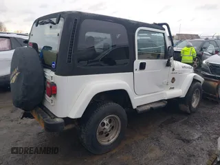 1997 Jeep Wrangler Sahara with VIN 1J4FY49S1VP503639, listed as a IAAI auction lot 41708134 with 102,196 mi miles and . Bid and sale history available at carsss.com. Image 4.