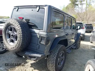 2019 Jeep Wrangler Unlimited Sport Altitude with VIN 1C4HJXDG3KW639148, listed as a IAAI auction lot 41933844 with 57,184 mi miles and . Bid and sale history available at DreamBid. Image 4.