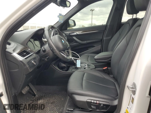 2022 BMW X1 xDrive28i with VIN WBXJG9C0XN5U63096, listed as a Copart auction lot 79253954 with 17,311 mi miles and Salvage title. Bid and sale history available at DreamBid. Image 7.