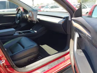 2023 Tesla Model 3 z VIN 5YJ3E1EA4PF454981, wystawiony jako IAAI lot #42704135 z przebiegiem 93 008 mil mil oraz . Historia ofert i sprzedaży dostępna na DreamBid. Obrazek 5.