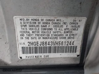 1997 Honda Civic EX with VIN 2HGEJ8643VH561244, listed as a IAAI auction lot 41810988 with 130,000 mi miles. Bid and sale history available at carsss.com. Image 9.