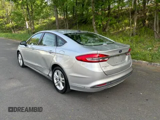 2018 Ford Fusion SE z VIN 3FA6P0LU9JR208728, wystawiony jako Copart lot #56345445 z przebiegiem 183 982 mil mil oraz Czysty tytuł • Clean title. Historia ofert i sprzedaży dostępna na DreamBid. Obrazek 3.