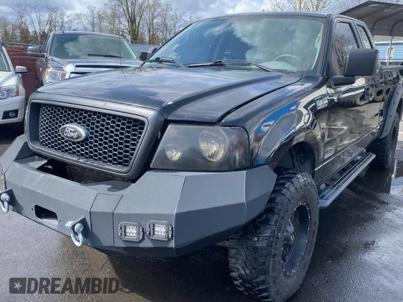 2005 Ford F-150 STX with VIN 1FTRX14W15NB53391, listed as a Copart auction lot 50452905 with 169,403 mi miles and Salvage Title. Bid and sale history available at carsss.com. Image 2.