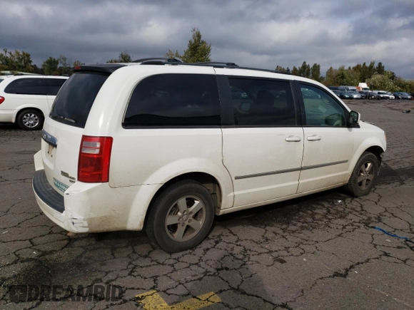 2010 Dodge Grand Caravan SXT with VIN 2D4RN5D11AR331804, listed as a Copart auction lot 73735873 with 183,923 mi miles and Salvage Title. Bid and sale history available at DreamBid. Image 3.