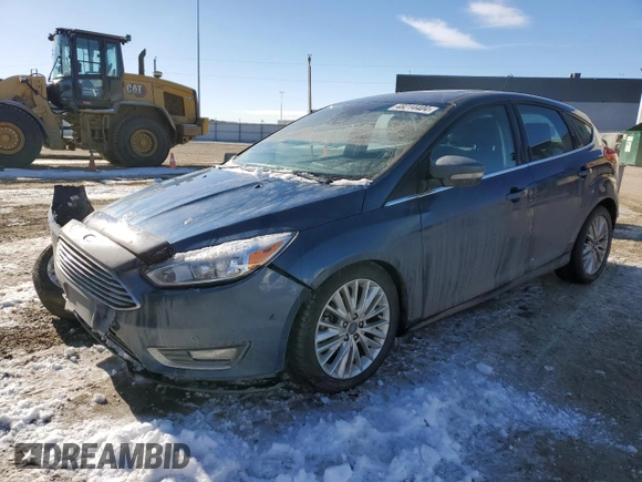 2018 Ford Focus Titanium z VIN 1FADP3N2XJL297048, wystawiony jako Copart lot #61579925 z przebiegiem 68 774 mil mil oraz Szkoda całkowita • Salvage title. Historia ofert i sprzedaży dostępna na DreamBid. Obrazek 1.