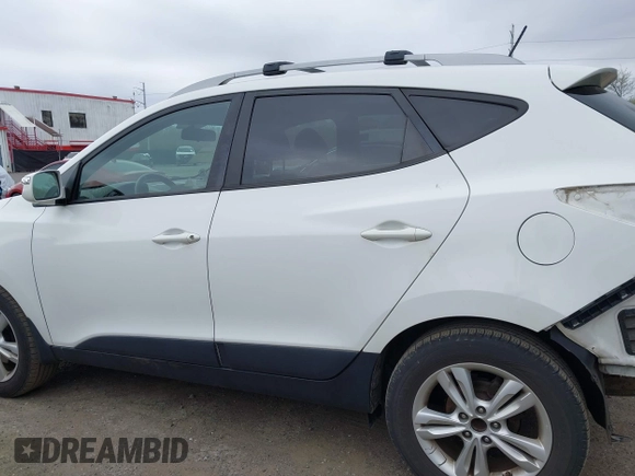 2013 Hyundai Tucson GLS with VIN KM8JU3AC5DU693550, listed as a IAAI auction lot 41919615 with 202,517 mi miles. Bid and sale history available at carsss.com. Image 14.