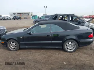 1999 Mercedes-Benz CLK with VIN WDBLK65G1XT013704, listed as a IAAI auction lot 42115880 with 85,741 mi miles. Bid and sale history available at carsss.com. Image 14.
