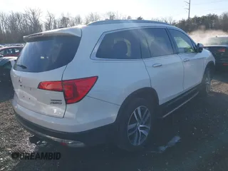 2017 Honda Pilot Touring with VIN 5FNYF6H98HB102313, listed as a IAAI auction lot 41244311 with 106,931 mi miles. Bid and sale history available at carsss.com. Image 4.