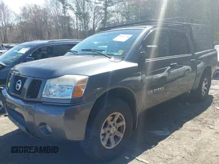 2005 Nissan Titan LE with VIN 1N6AA07B35N553838, listed as a IAAI auction lot 42101718 with 123,800 mi miles. Bid and sale history available at carsss.com. Image 2.