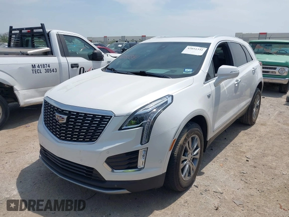2021 Cadillac XT5 FWD Premium Luxury z VIN 1GYKNCR42MZ174309, wystawiony jako IAAI lot #42051341 z przebiegiem 75 544 mil mil oraz . Historia ofert i sprzedaży dostępna na DreamBid. Obrazek 18.