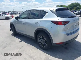 2017 Mazda CX-5 Sport with VIN JM3KFABLXH0135560, listed as a IAAI auction lot 42062016 with 153,416 mi miles. Bid and sale history available at carsss.com. Image 3.