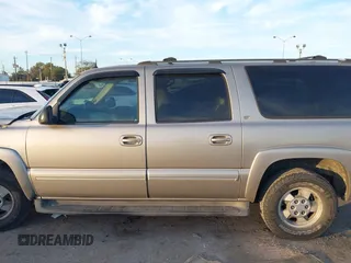 2003 Chevrolet Suburban LT z VIN 3GNEC16Z03G317762, wystawiony jako IAAI lot #40997537 z przebiegiem Nie podano mil oraz . Historia ofert i sprzedaży dostępna na DreamBid. Obrazek 14.