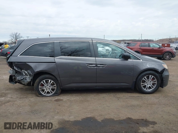 2012 Honda Odyssey EX-L with VIN 5FNRL5H65CB042898, listed as a IAAI auction lot 41784075 with 179,596 mi miles and . Bid and sale history available at carsss.com. Image 13.