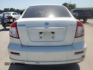2009 Suzuki SX4 z VIN JS2YC416396200021, wystawiony jako Copart lot #56676075 z przebiegiem 150 981 mil mil oraz Szkoda całkowita • Salvage title. Historia ofert i sprzedaży dostępna na DreamBid. Obrazek 6.