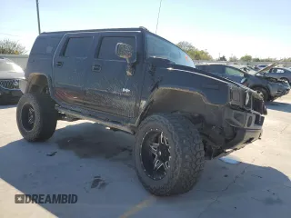 2005 Hummer H2 SUV with VIN 5GRGN23U95H101796, listed as a Copart auction lot 76991574 with 88,204 mi miles and Salvage Title. Bid and sale history available at carsss.com. Image 4.