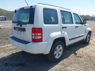 2012 Jeep Liberty Sport z VIN 1C4PJMAK7CW209305, wystawiony jako IAAI lot #42105378 z przebiegiem 136 617 mil mil oraz . Historia ofert i sprzedaży dostępna na DreamBid. Obrazek 4.