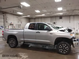 2014 Toyota Tundra 4WD Truck SR with VIN 5TFUY5F17EX357035, listed as a IAAI auction lot 39928076 with 129,831 mi miles. Bid and sale history available at carsss.com. Image 13.