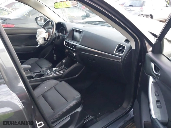 2016 Mazda CX-5 Grand Touring with VIN JM3KE4DYXG0684638, listed as a IAAI auction lot 41101563 with NaN miles. Bid and sale history available at carsss.com. Image 5.