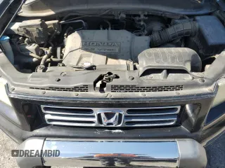 2006 Honda Ridgeline RTL z VIN 2HJYK16586H545773, wystawiony jako Copart lot #58658325 z przebiegiem 166 355 mil mil oraz Czysty tytuł • Clean title. Historia ofert i sprzedaży dostępna na DreamBid. Obrazek 11.