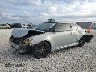 2014 Scion tC z VIN JTKJF5C79E3067932, wystawiony jako Copart lot #50425555 z przebiegiem Nie podano mil oraz Szkody całkowita. Historia ofert i sprzedaży dostępna na DreamBid. Obrazek 1.