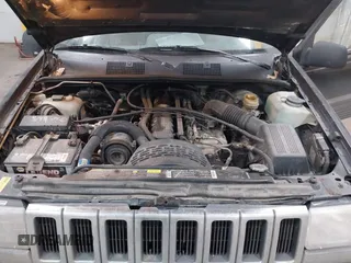 1995 Jeep Grand Cherokee Laredo with VIN 1J4GZ58S6SC765863, listed as a IAAI auction lot 41797726 with 234,715 mi miles and . Bid and sale history available at DreamBid. Image 10.
