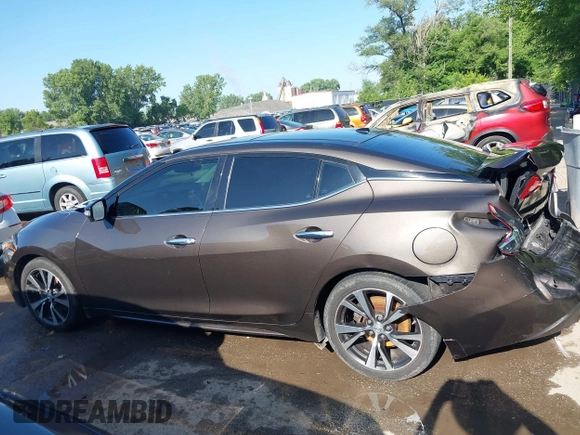 2016 Nissan Maxima Platinum z VIN 1N4AA6AP3GC385276, wystawiony jako IAAI lot #42547410 z przebiegiem 100 307 mil mil oraz . Historia ofert i sprzedaży dostępna na DreamBid. Obrazek 13.