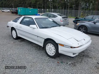 1986 Toyota Supra z VIN JT2MA70L4G0005514, wystawiony jako IAAI lot #42247815 z przebiegiem 88 534 mil mil oraz . Historia ofert i sprzedaży dostępna na DreamBid. Obrazek 1.