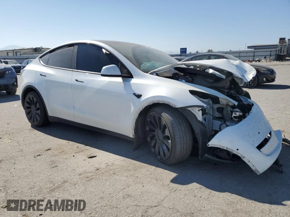 2022 Tesla Model Y Performance with VIN 7SAYGDEF9NF392197, listed as a Copart auction lot 57259105 with 43,400 mi miles and Salvage title. Bid and sale history available at DreamBid. Image 4.