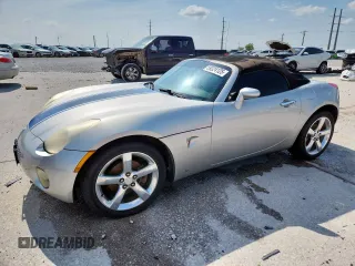 2006 Pontiac Solstice z VIN 1G2MB35BX6Y117932, wystawiony jako Copart lot #59324125 z przebiegiem 128 944 mil mil oraz Szkoda całkowita • Salvage title. Historia ofert i sprzedaży dostępna na DreamBid. Obrazek 1.