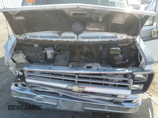 1990 Chevrolet Chevy Van z VIN 1GBEG25K0L7167885, wystawiony jako Copart lot #72575264 z przebiegiem 231 827 mil mil oraz Szkoda całkowita • Salvage title. Historia ofert i sprzedaży dostępna na DreamBid. Obrazek 13.