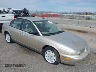 1997 Saturn SL z VIN 1G8ZJ5273VZ311463, wystawiony jako IAAI lot #41900904 z przebiegiem 131 738 mil mil oraz . Historia ofert i sprzedaży dostępna na DreamBid. Obrazek 1.
