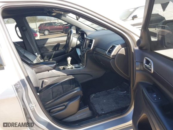 2018 Jeep Grand Cherokee Laredo E with VIN 1C4RJFAG0JC284927, listed as a IAAI auction lot 41964013 with 130,145 mi miles. Bid and sale history available at carsss.com. Image 5.