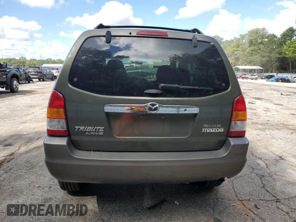 2002 Mazda Tribute LX with VIN 4F2YU09122KM55085, listed as a Copart auction lot 71604184 with 185,158 mi miles and Salvage Title. Bid and sale history available at DreamBid. Image 6.