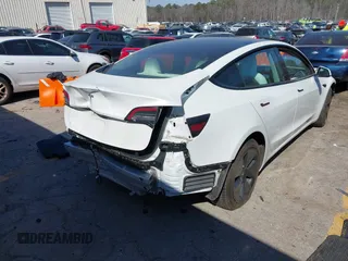 2022 Tesla Model 3 with VIN 5YJ3E1EA7NF103513, listed as a IAAI auction lot 41643592 with 35,631 mi miles and . Bid and sale history available at DreamBid. Image 4.