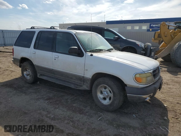 2000 Ford Explorer XLT with VIN 1FMZU83PXYZA71034, listed as a Copart auction lot 55447585 with 175,118 mi miles and Salvage title. Bid and sale history available at DreamBid. Image 4.