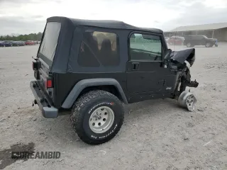 2000 Jeep Wrangler Sport with VIN 1J4FA49S9YP743515, listed as a Copart auction lot 53906305 with 247,349 mi miles and Salvage title. Bid and sale history available at DreamBid. Image 3.