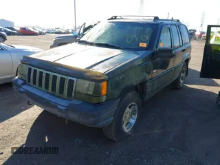 1997 Jeep Grand Cherokee Laredo with VIN 1J4GZ58S2VC605385, listed as a IAAI auction lot 41797715 with 169,996 mi miles and . Bid and sale history available at DreamBid. Image 6.