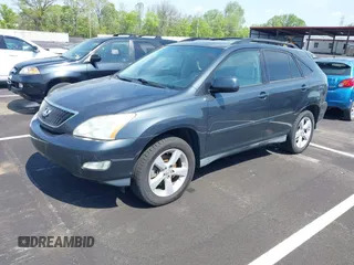 2007 Lexus RX with VIN 2T2GK31U07C021695, listed as a IAAI auction lot 42032252 with 146,023 mi miles. Bid and sale history available at carsss.com. Image 2.