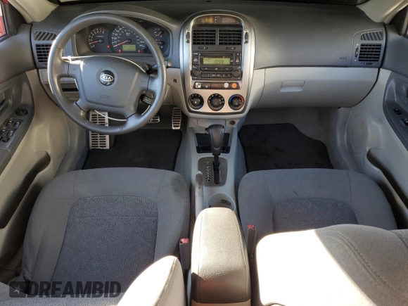 2005 Kia Spectra with VIN KNAFE161455146328, listed as a Copart auction lot 77605534 with 110,605 mi miles and Salvage Title. Bid and sale history available at DreamBid. Image 8.