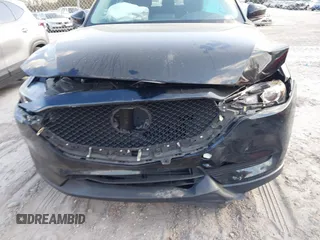 2019 Mazda CX-5 Sport with VIN JM3KFABMXK0693540, listed as a IAAI auction lot 41523569 with 57,895 mi miles and . Bid and sale history available at DreamBid. Image 6.