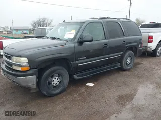 2003 Chevrolet Tahoe LT with VIN 1GNEC13Z33R166971, listed as a IAAI auction lot 41356669 with 318,527 mi miles. Bid and sale history available at carsss.com. Image 2.