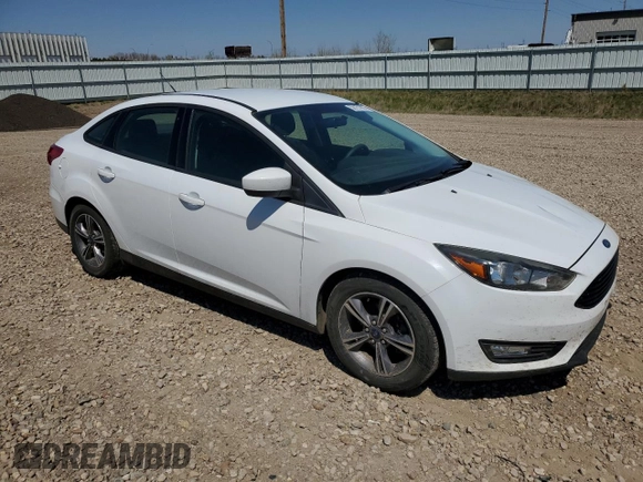 2018 Ford Focus SE with VIN 1FADP3FE0JL227146, listed as a Copart auction lot 56151985 with 124,517 mi miles and Salvage title. Bid and sale history available at DreamBid. Image 4.