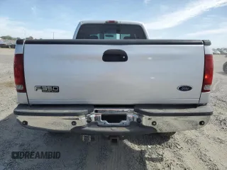 2004 Ford F-350 XL with VIN 1FTSW31P04EC44129, listed as a Copart auction lot 63519165 with 205,411 mi miles and Salvage title. Bid and sale history available at DreamBid. Image 6.