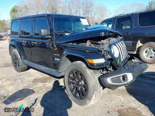 2021 Jeep Wrangler 4xe Unlimited Sahara with VIN 1C4JJXP68MW730679, listed as a IAAI auction lot 41219074 with 28,794 mi miles. Bid and sale history available at carsss.com. Image 1.
