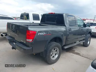 2011 Nissan Titan Pro-4X with VIN 1N6BA0EC3BN320795, listed as a IAAI auction lot 41868113 with 183,919 mi miles and . Bid and sale history available at DreamBid. Image 4.