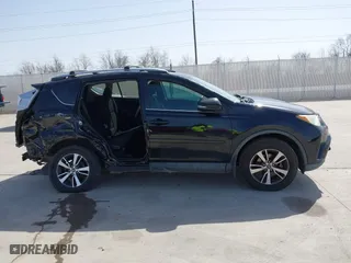 2016 Toyota RAV4 XLE with VIN 2T3WFREV9GW292772, listed as a IAAI auction lot 41727898 with 117,922 mi miles. Bid and sale history available at carsss.com. Image 13.