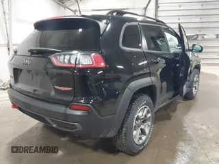 2022 Jeep Cherokee Trailhawk with VIN 1C4PJMBX8ND517236, listed as a IAAI auction lot 41530369 with 34,164 mi miles and . Bid and sale history available at DreamBid. Image 4.